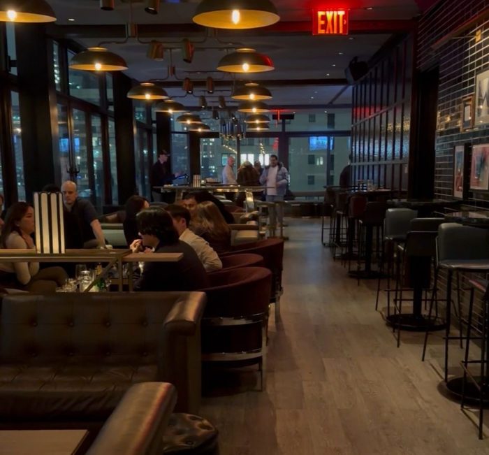 Guests gather at The Skylark in Manhattan, where a diverse crowd, curated music and live DJs create a vibrant, upscale atmosphere high above the city.