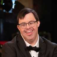 Actor with Down Syndrome Race Eberhardt, who stars in the upcoming action film Strait Undercover (2026), which premiered on YouTube on March 21, in honor of Down Syndrome Awareness Day.