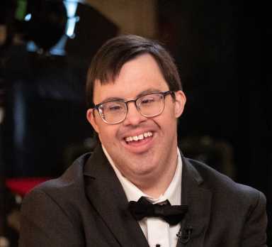Actor with Down Syndrome Race Eberhardt, who stars in the upcoming action film Strait Undercover (2026), which premiered on YouTube on March 21, in honor of Down Syndrome Awareness Day.