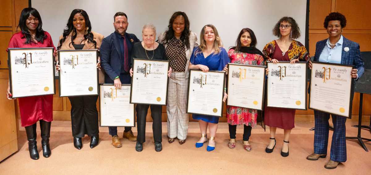 Assembly Member Rodneyse Bichotte Hermelyn (center) with honorees.