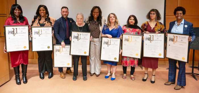 Assembly Member Rodneyse Bichotte Hermelyn (center) with honorees.