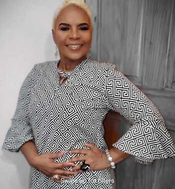 Carol A. Fraser, founder of Miracle Hands Designs, sculptor, fashion and costume designer wearing one of her creations.