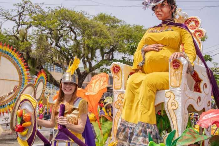 Birth of An Era of Health and Wellness, designed for the Ministry of Health Guyana, by creator Carol A. Fraser for the 2026 Mashramani Parade in Georgetown, showcases a pregnant woman perched high on a float being pulled along the route by a reveler.