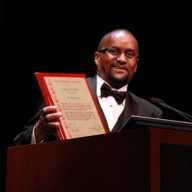 Don “Sunshine” Diaz accepting the SUNSHINE Awards Hall of Fame Induction for his father, Cyril Diaz in 2011.