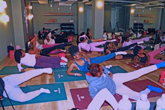 Attendees participate in a Pilates session during IYKYK Collective’s second annual Women’s Wellness Day, celebrating International Women’s Month.