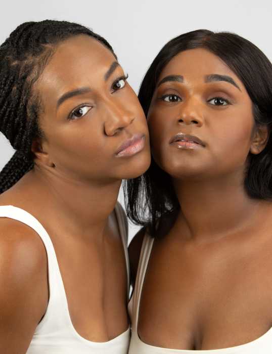 Clients wear Yuvana Beauty foundation, lipgloss and lip liners during a promotional event in New York.