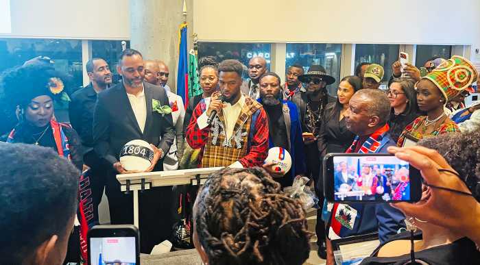 Duckens Nazon addresses the crowd at the Museum of Contemporary African Diasporan Arts (MoCADA) Gallery + Café in Brooklyn for “A Night for Haiti" event.