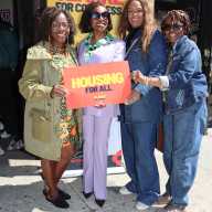 U.S. Rep. Yvette D. Clarke, second from left, with 'Housing for All' poster, flanked by her Brooklyn District Director Anita Taylor, second from right; Rose Graham, assistant principal in Brooklyn, right; and Claire Patterson-Monah, former executive director of the Brooklyn-based Guyana Cultural Association of New York, Inc., left.