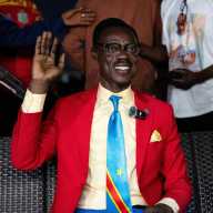 Democratic Republic of the Congo fan Michel Nkuka Mboladinga, dressed as the country's independence hero Patrice Lumumba, as fans watch the FIFA World Cup Inter-Confederation Playoff match between DR Congo and Jamaica in Kinshasa, Democratic Republic of Congo March 31, 2026.