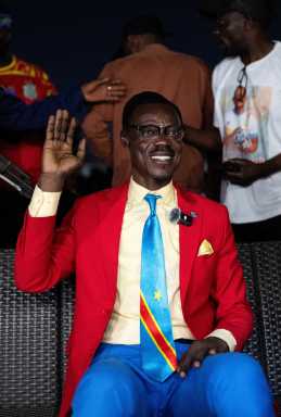 Democratic Republic of the Congo fan Michel Nkuka Mboladinga, dressed as the country's independence hero Patrice Lumumba, as fans watch the FIFA World Cup Inter-Confederation Playoff match between DR Congo and Jamaica in Kinshasa, Democratic Republic of Congo March 31, 2026.