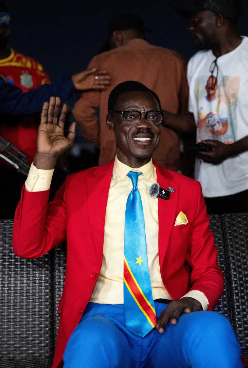 Democratic Republic of the Congo fan Michel Nkuka Mboladinga, dressed as the country's independence hero Patrice Lumumba, as fans watch the FIFA World Cup Inter-Confederation Playoff match between DR Congo and Jamaica in Kinshasa, Democratic Republic of Congo March 31, 2026.