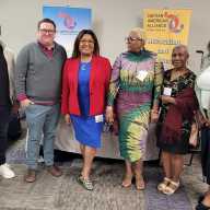 Staff and supporters of the Haitian American Alliance of New York, Inc. at a community event. From left: Colbert Saint-Laurent, director of Capacity Building; Geogg Pipoly, Esq.; Yolette Williams, president & CEO; Judith Wackman, DNP/PMHNP; Rosia Lamarre, DC; and Marjorie Bonhomme, PhD.