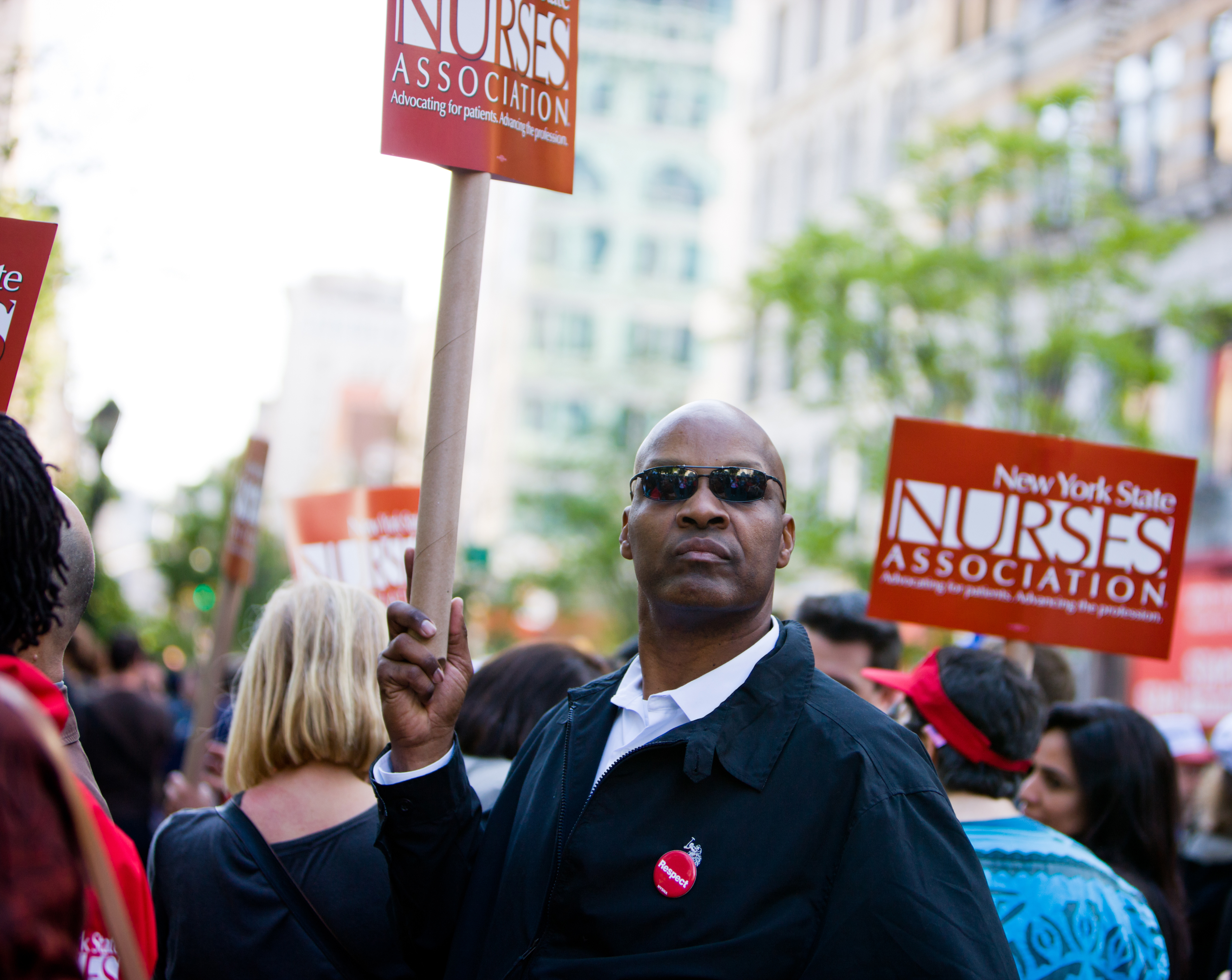 New York, USA - May 1, 2012: Man holding NY Nurses Association banner on Union Square during 1st May demonstration.