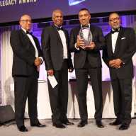 Jamaica Prime Minister Andrew Holness, second from right, receives Legacy Award, flanked by Dr. Cyrus McCalla, the Jamaican-born chairman of AFUWI, right; The University of the West Indies (UWI) Chancellor Dr. Dodridge D. Miller, left, and UWI Vice Chancellor Professor Sir Hilary Beckles, second from left.