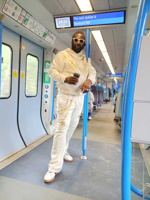 Ras Emmanuel on a train in the UK.