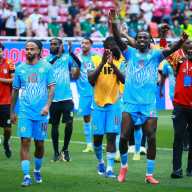 DR Congo's Ngal'ayel Mukau and Theo Bongonda celebrate qualifying for the FIFA World Cup.