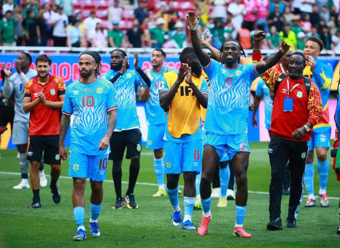 DR Congo's Ngal'ayel Mukau and Theo Bongonda celebrate qualifying for the FIFA World Cup.