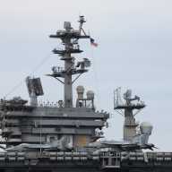 U.S. Navy aircraft carrier USS Nimitz is anchored in the Guanabara Bay as part of the Southern Seas 2026 deployment for joint naval exercises, while the Brazilian Navy conducts radiological monitoring operations near its position, in Rio de Janeiro, Brazil May 8, 2026.