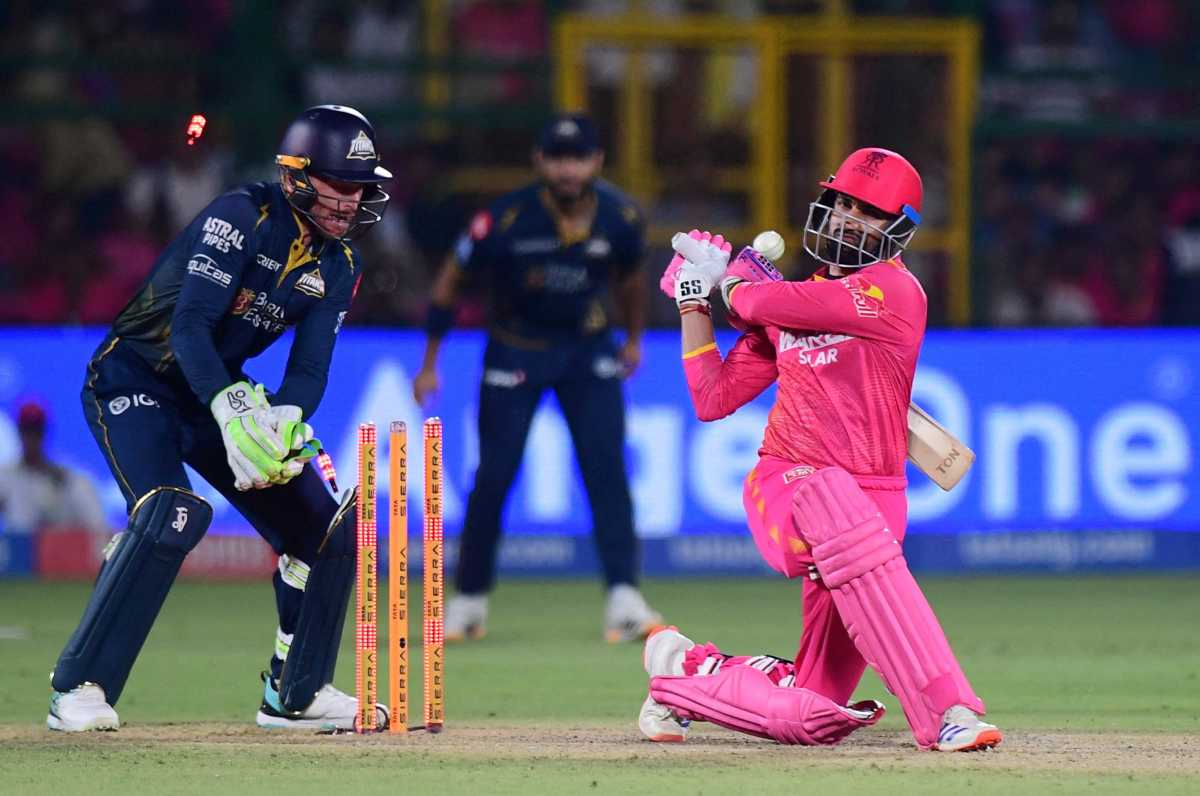 Rajasthan Royals' Shubham Dubey is bowled out by Gujarat Titans' Rashid Khan.