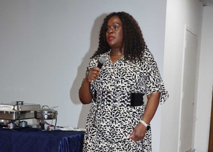 Kylla Herbert, coordinator of the St. Kitts and Nevis Penn Relays initiative, addresses reception in Philadelphia