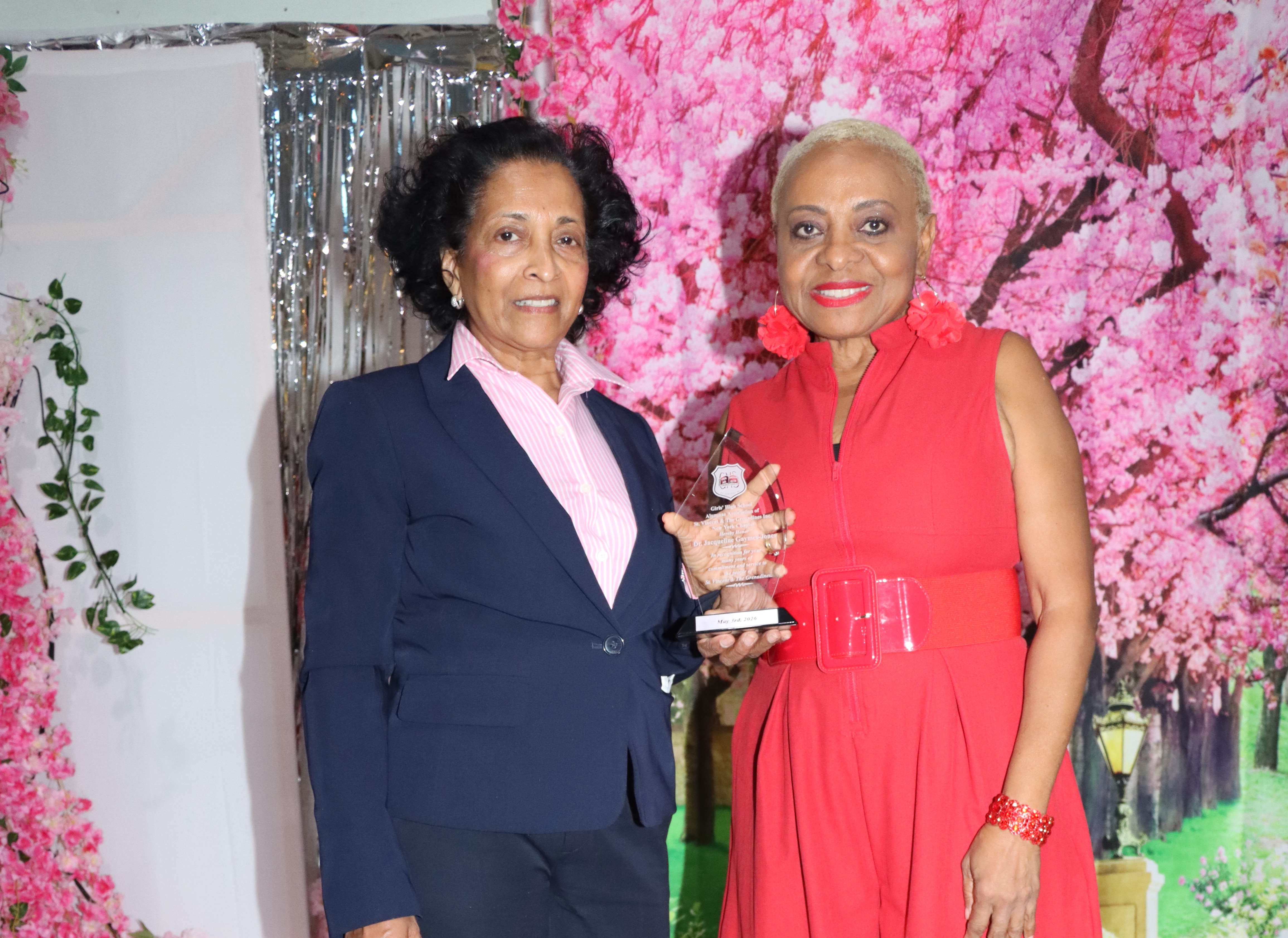 Dr. Jacqueline Dr. Jacqueline Gaymes-Jones, left, receives award from Maxine Mayers.