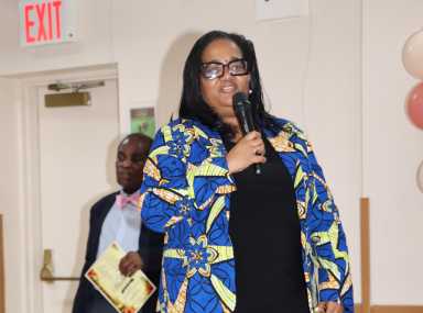 St. Vincent and the Grenadines Ambassador to the United Nations Vynette Frederick addresses ceremony. SPOONY General Secretary Kenneth Williams is in background.