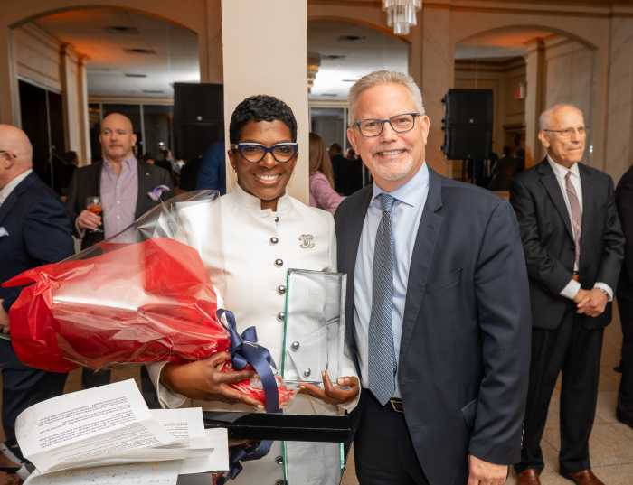 Justice Dena Douglas accepts the award from Kings County Criminal Bar Association (KCCBA) President Michael Sheinberg, Esq. 