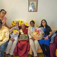 Family members from left, sitting, nephew Linden Levi, Son Jermone Serrao, Mrs. Eulah Evelyn Levi-Marque, Consulate staffers, Nacifa Watson, and Fazia Khusial, a family friend, and standing, Daughter-in-law, Judy Boyce-Serrao.