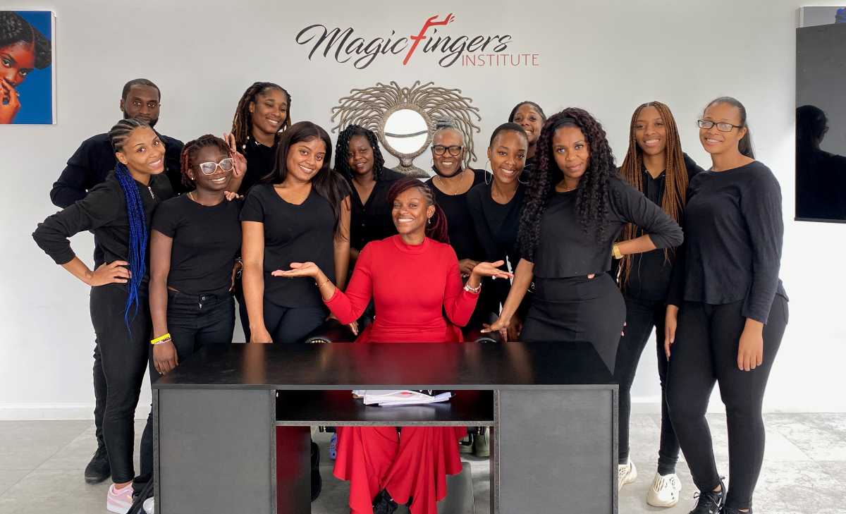 Stasha Harris with students during a hands-on training session at Magic Fingers Institute in Queens.