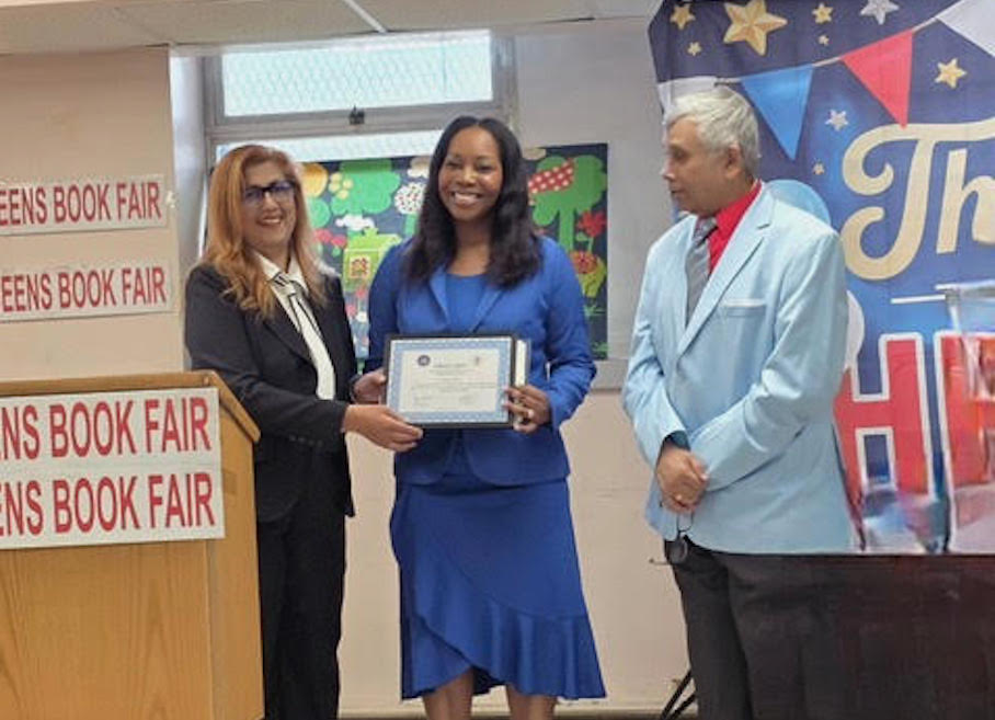 Community Board 9 Chairperson Sherry Algredo (left) presented Dr. Veronica Wiltshire (center) with an Award for her outstanding work in medicine and community service, as Dhanpaul Narine looks on, at a May 2 Honoring Hometown Heroes presentation by the Queens Book Fair.