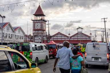People walk outside the Stabroek Market in Georgetown, Guyana May 9, 2026.