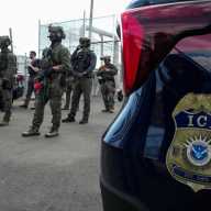 U.S. Immigration and Customs Enforcement (ICE) agents and federal agents secure the entrance to the Delaney Hall detention center, as demonstrators remain gathered outside, in Newark, New Jersey, U.S., May 29, 2026.