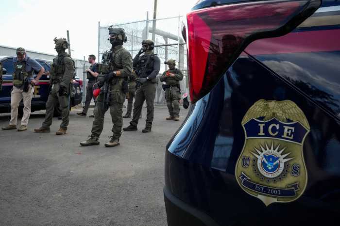 U.S. Immigration and Customs Enforcement (ICE) agents and federal agents secure the entrance to the Delaney Hall detention center, as demonstrators remain gathered outside, in Newark, New Jersey, U.S., May 29, 2026.