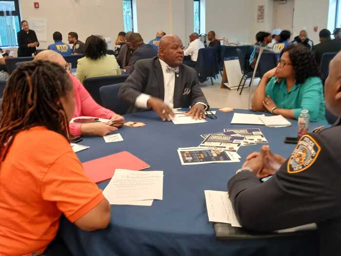 At center of table is Brother Paul Mohammed in discussion with the group and facilitator at Rehoboth Open Bible Church in East Flatbush.