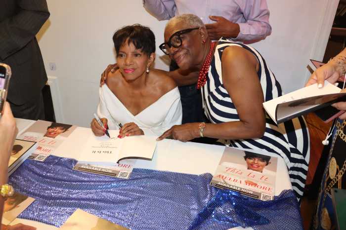Melba Moore, left, signs a copy of her new memoir, “This Is It: Marvelous & Getting Better,” for retired Vincentian Registered Nurse US Army Reserve Colonel Celia Bramble.