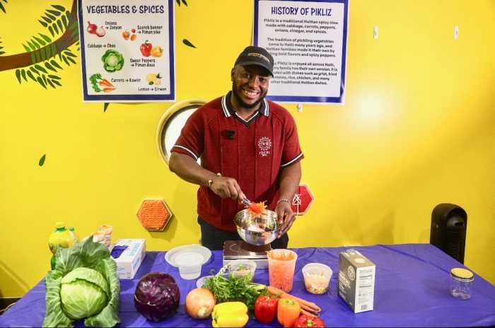 Jonathan Pierre Lafleur displays the colorful ingredients behind Haiti’s iconic pikliz.