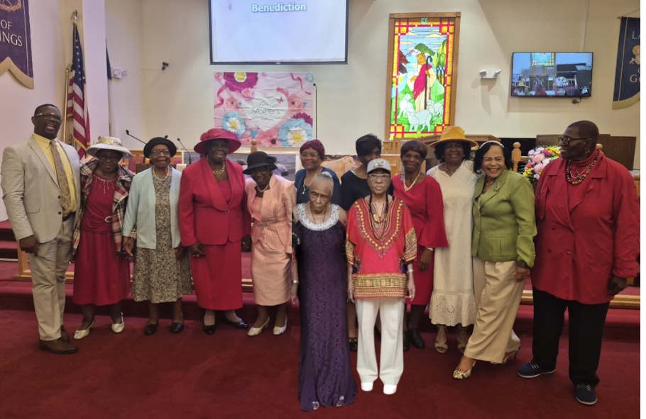 The Rev. Derwin Grant, pastor of Trinity Methodist Church, left, with honorees on Mother's Day 2026.