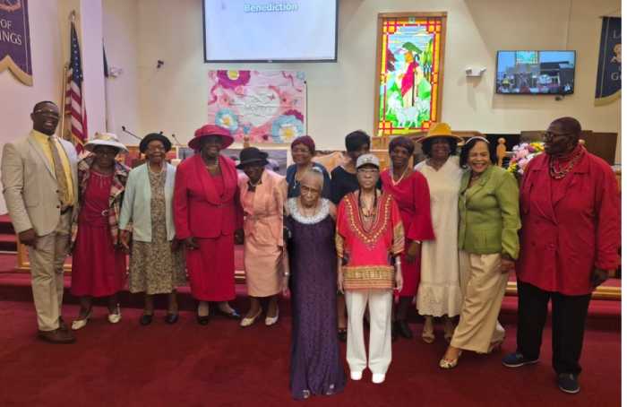 The Rev. Derwin Grant, pastor of Trinity Methodist Church, left, with honorees on Mother's Day 2026.