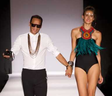 Awarding-winning, Brooklyn-based Fashion Designer Roger Gary, left, with a model wearing a swimwear from his Spring, Summer Resort collection, recently shown on the runway of Summer Sizzle fashion show, in the British Virgin Islands.